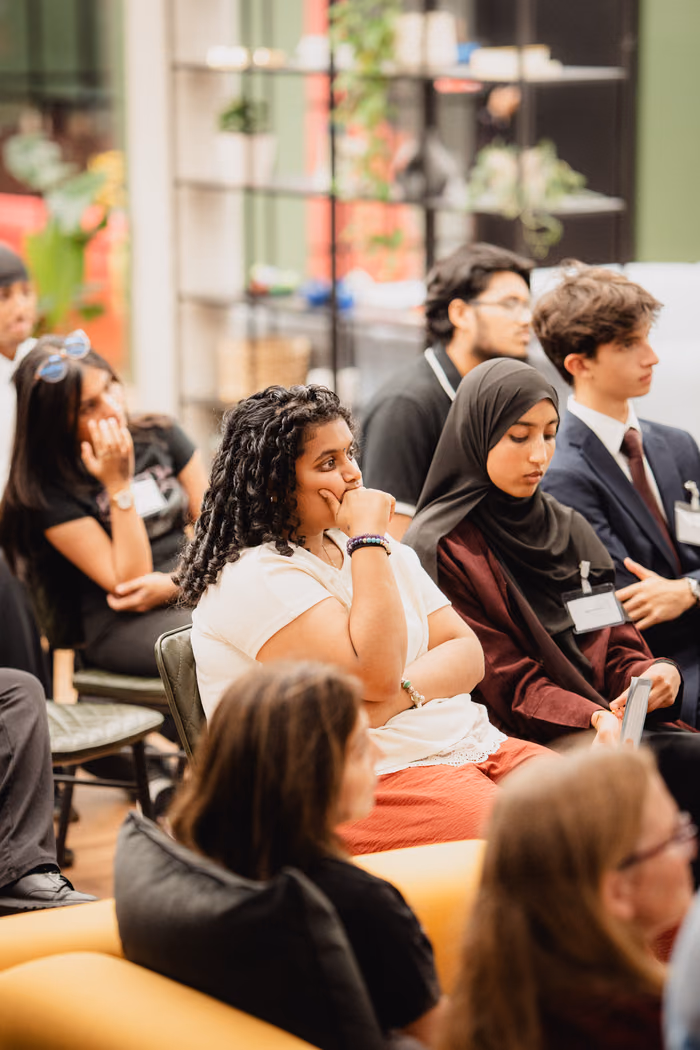 The audience listening to a pitch.