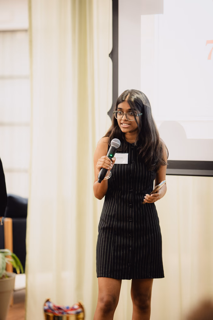 A finalist pitching on stage.
