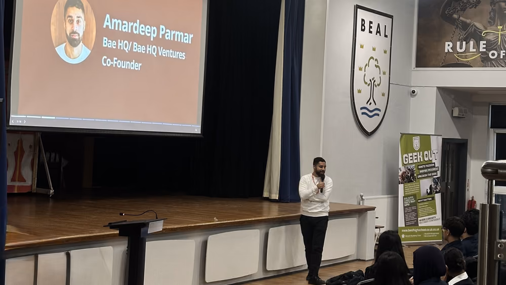 A Youth Startups talk on stage at a partner school.